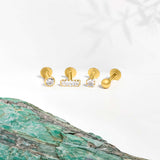 Marketing image of 9c gold piercings, 4 different styles, placed on next to each other agains white background. 