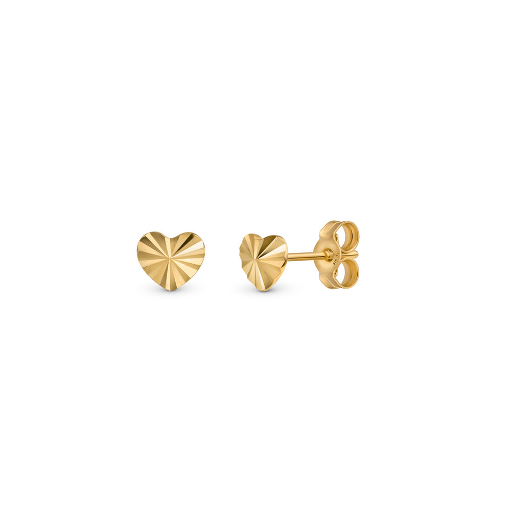 Gold diamond cut design heart ear studs presented against white background.