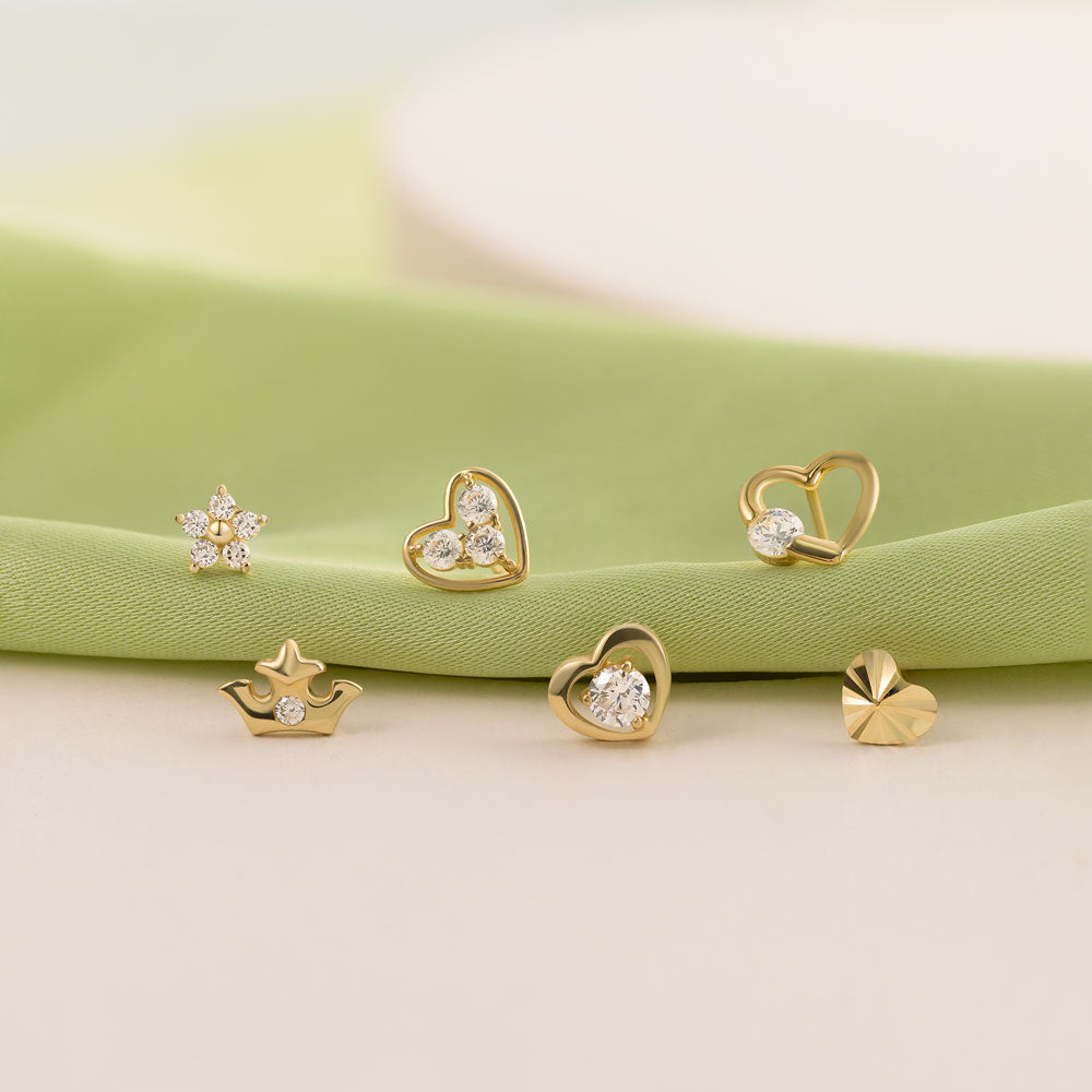 6 different ear studs from Daily Studs Collection, featuring Gold Heart Studs, Crown Design Studs and Flower Studs. 