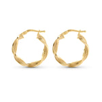 Gold hoop earrings with textured pattern placed against a white background