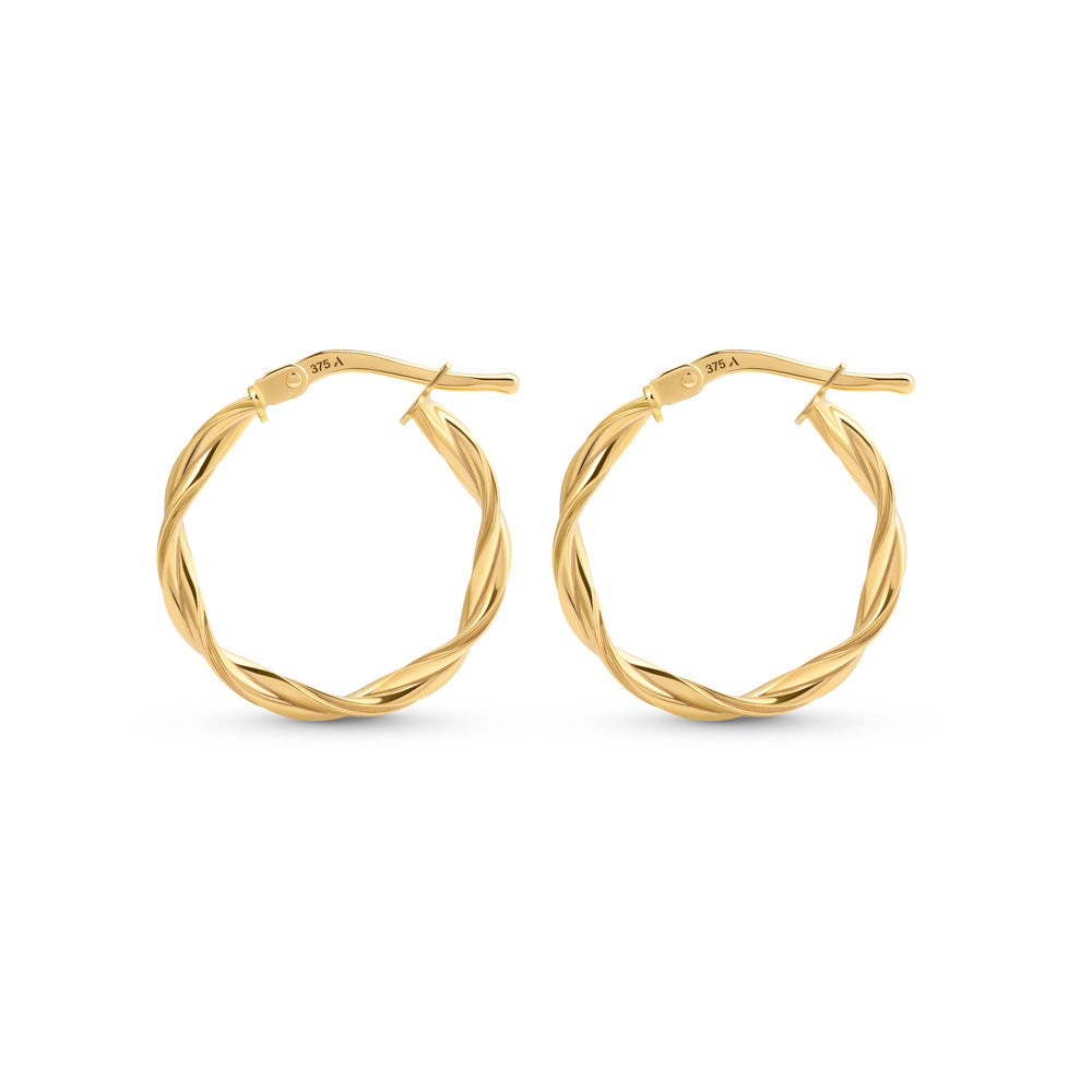 Gold hoop earrings with double twisted pattern placed against a white background