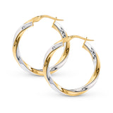 2 tone 20 mm gold hoop earrings with a twisted pattern placed against a white background