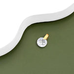 9ct gold Round crystal pendant placed on a white surface.