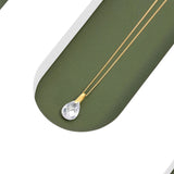 An image showing one 9ct gold Waterdrop crystal pendant placed on a green and white background.