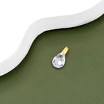 9ct gold Waterdrop crystal pendant placed on a white surface.