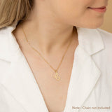 A woman wearing a gold necklace with an alphabet pendant in the shape of the letter 'C'. The text in the corner notes, "Note: Chain not included.