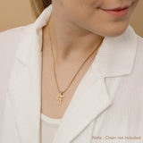 A woman wearing a gold necklace with an alphabet pendant in the shape of the letter 'F'. The text in the corner notes, "Note: Chain not included.