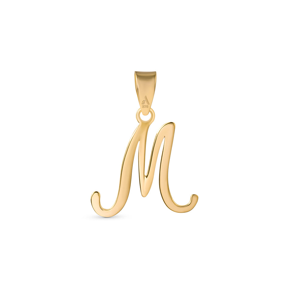 A gold pendant shaped like the letter "M" designed with elegant curves and a flowing script style with a small loop at the top for attaching to a chain.