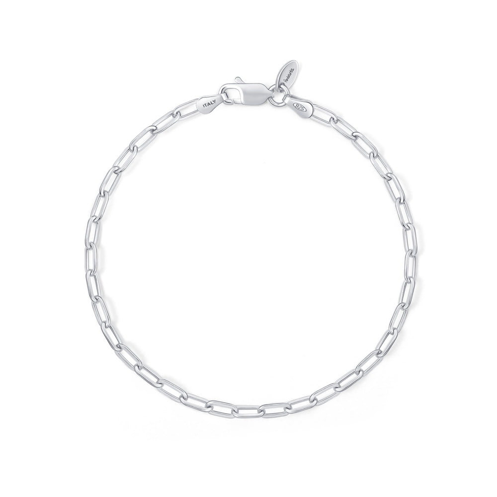 A silver paperclip chain bracelet on a white background