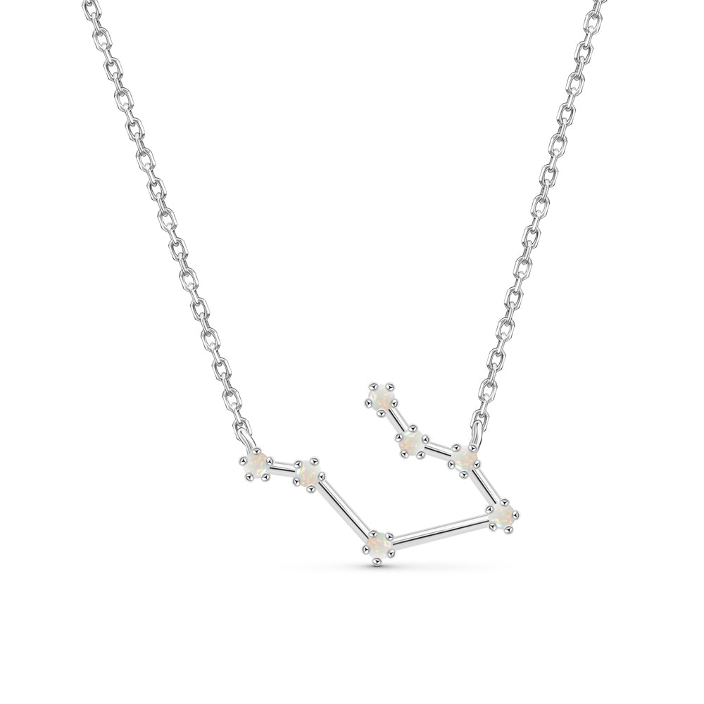 Gemini silver constellation necklace placed against a white background