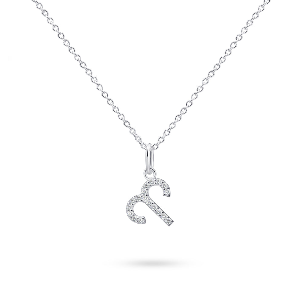 Product image of sterling silver necklace with aries zodiac pendant with stones against white background.