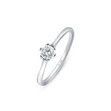 Silver solitaire engagement ring with CZ stone in 4mm placed on a white surface.