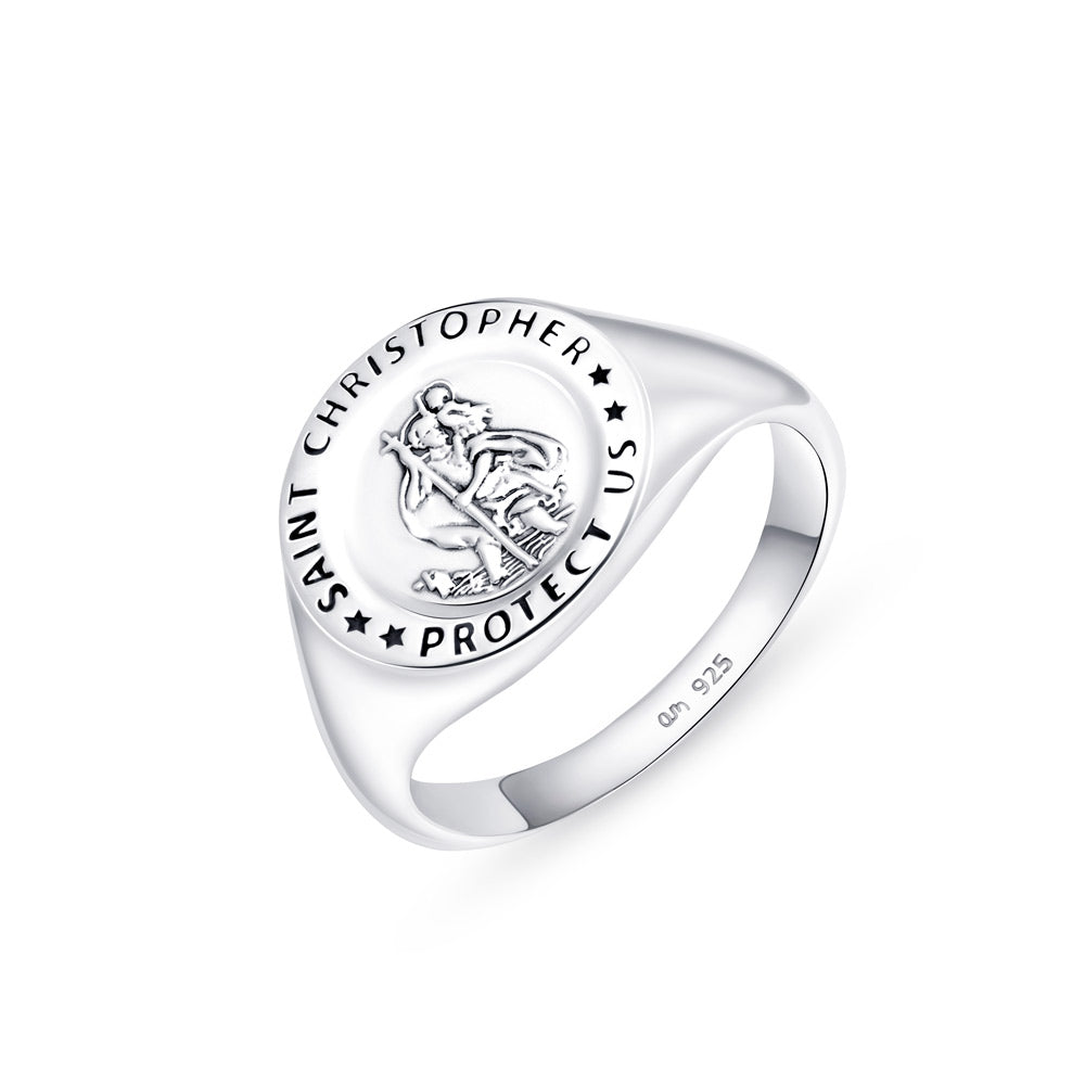 A broad silver ring with St Christopher emblem on it placed on a white surface