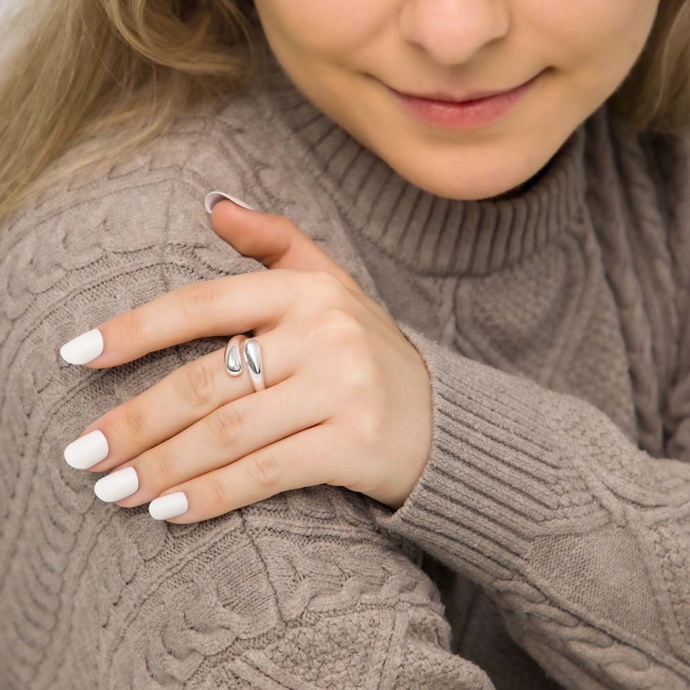 Model wearing sterling silver teardrop statement ring.