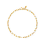 A gold plated paperclip chain bracelet on a white background