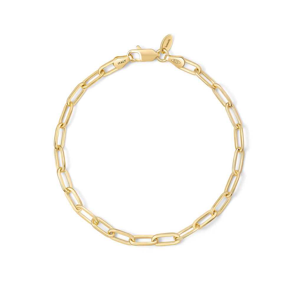 A gold plated paperclip chain bracelet on a white background