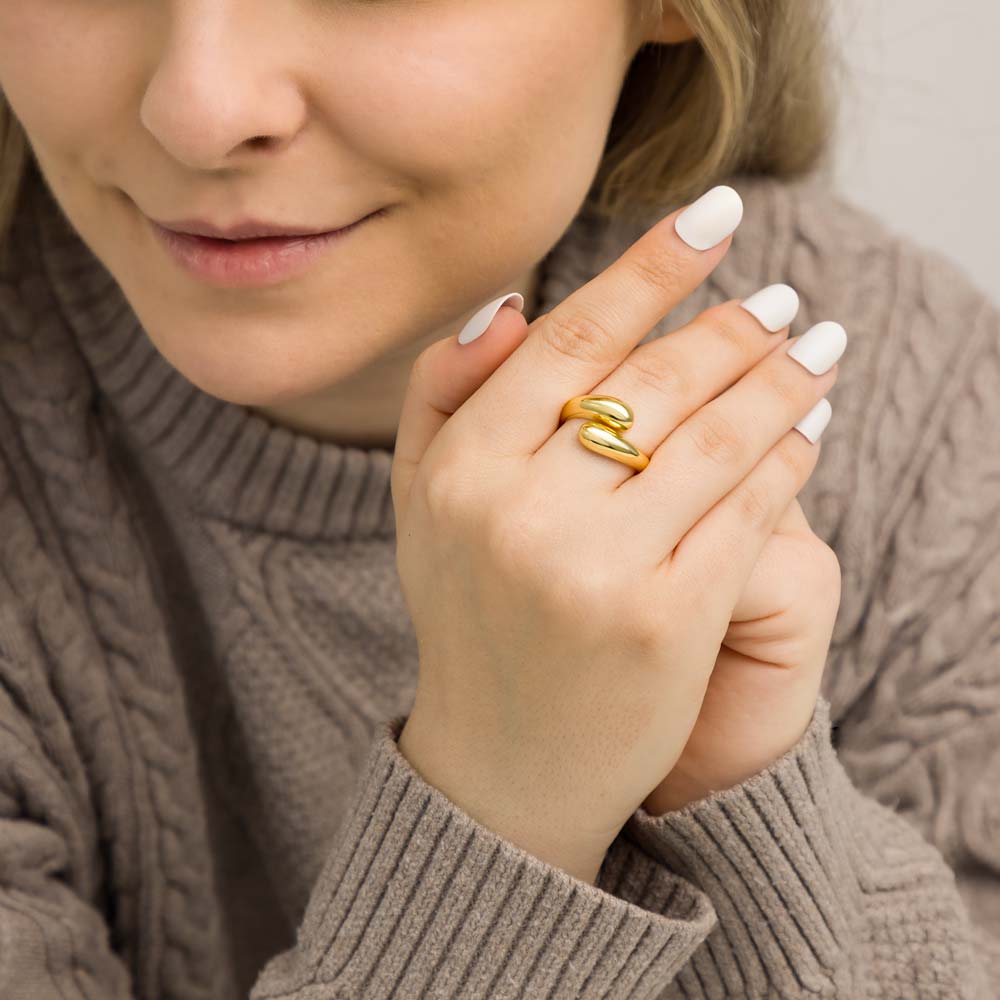 Model wearing gold plated sterling silver teardrop statement ring.