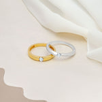 An image showing two solitaire wedding band with CZ stone in 3mm in silver and gold plated.