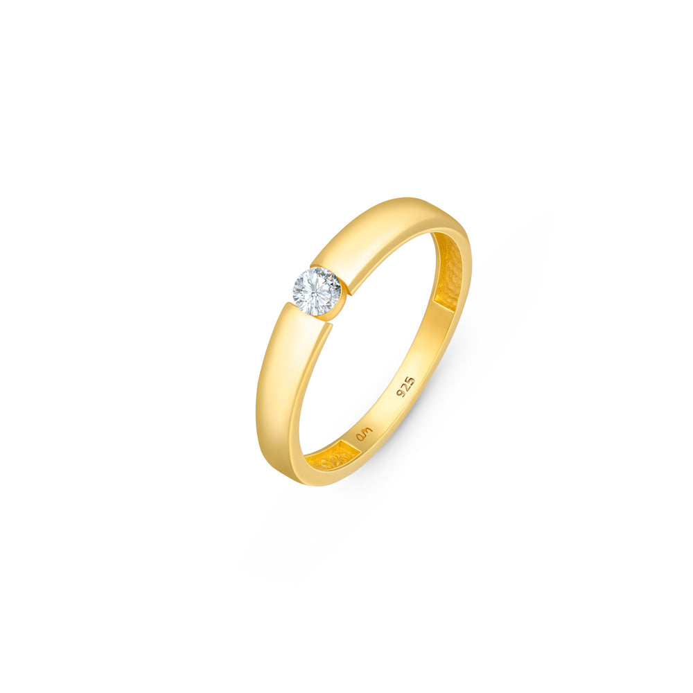 Gold plated solitaire wedding band with CZ stone in 3mm placed on a white surface.