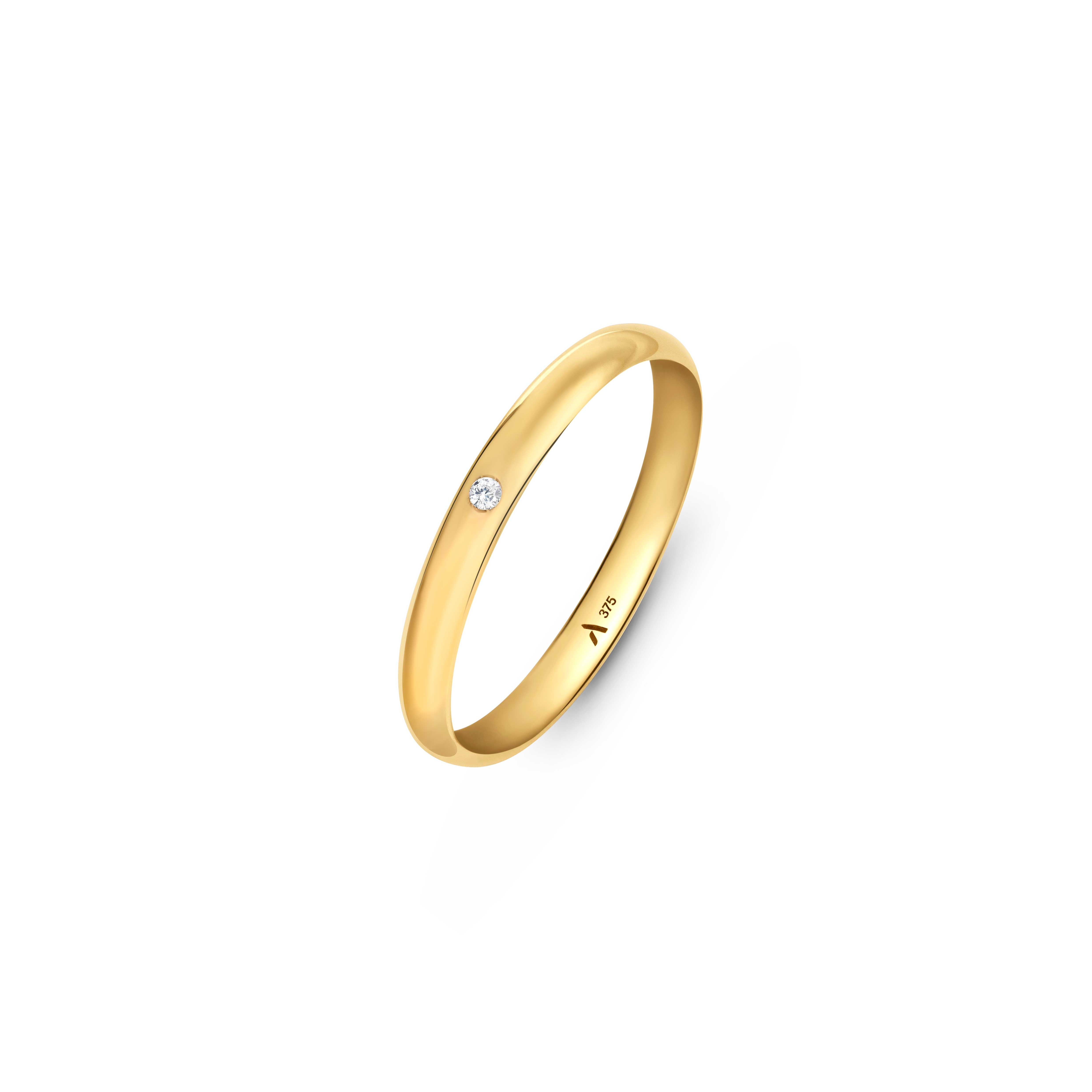 A 9ct gold wedding band with 1.3 mm cubic zirconia stone placed on a clean white background